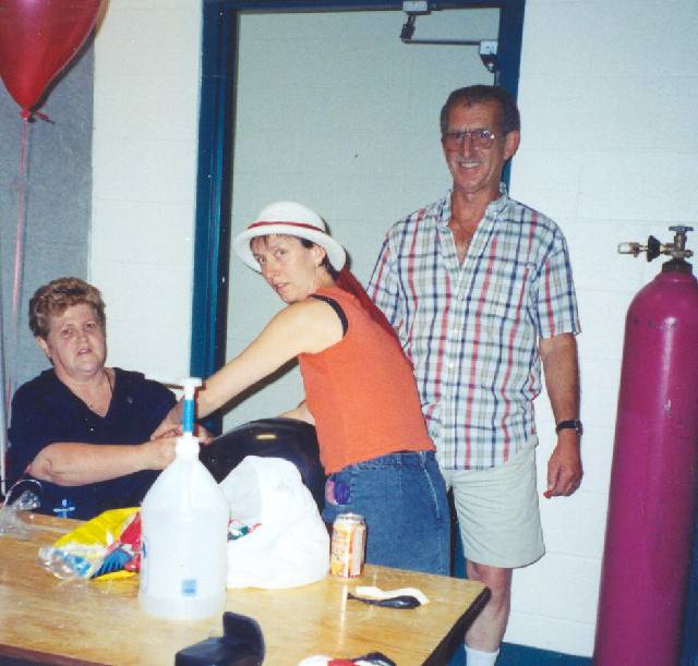 Linda (McKay) Cosar, Susie Bartsch, Lloyd Cosar.  
Blowing up the baloons. :: Click image to download full-sized image